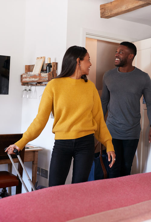 A couple inspecting a short term let