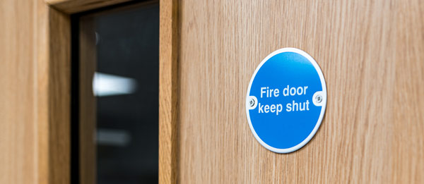 Close-up of a fire door during an inspection