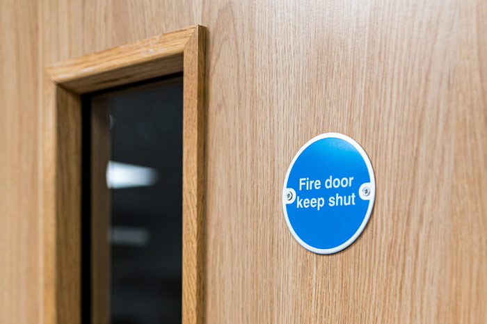 A close up of a wooden fire door