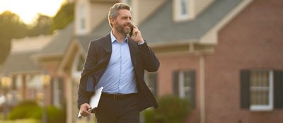 A managing agent walking to a house