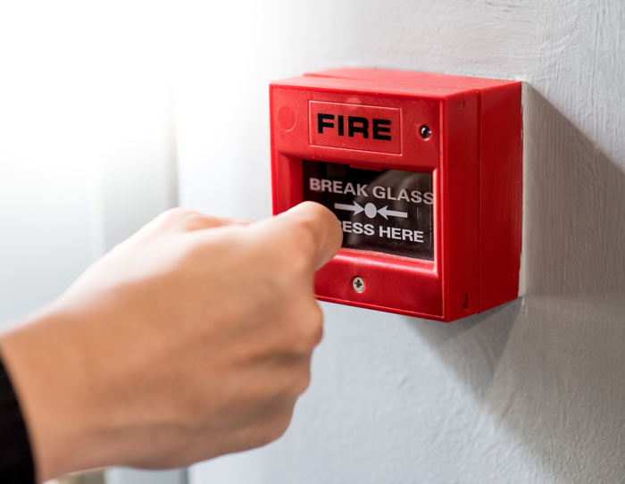 An accredited fire risk assessor at work in a Gloucester property