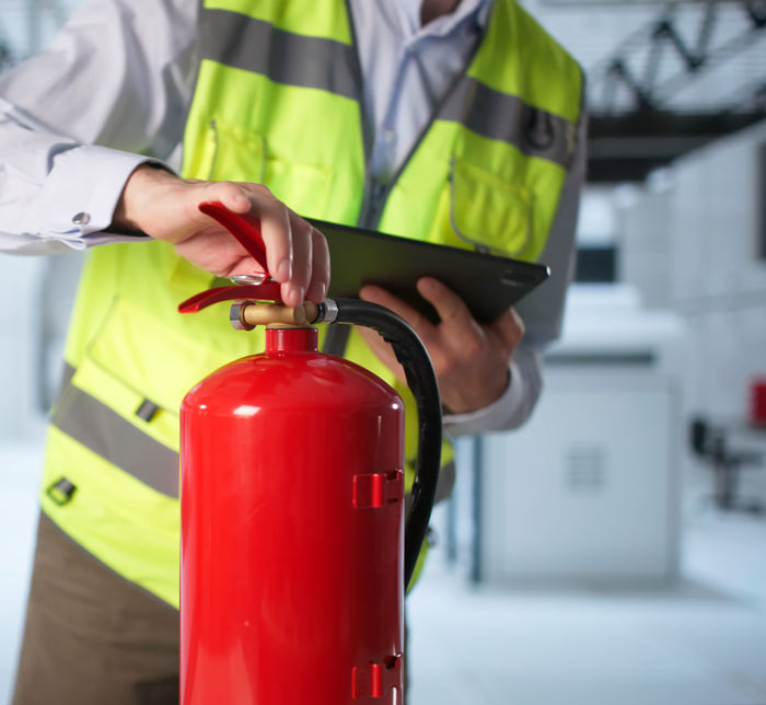 Fire risk assessment being carried out in a Gloucester commercial property