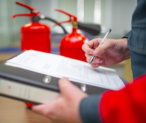 A man writing on an inspection document